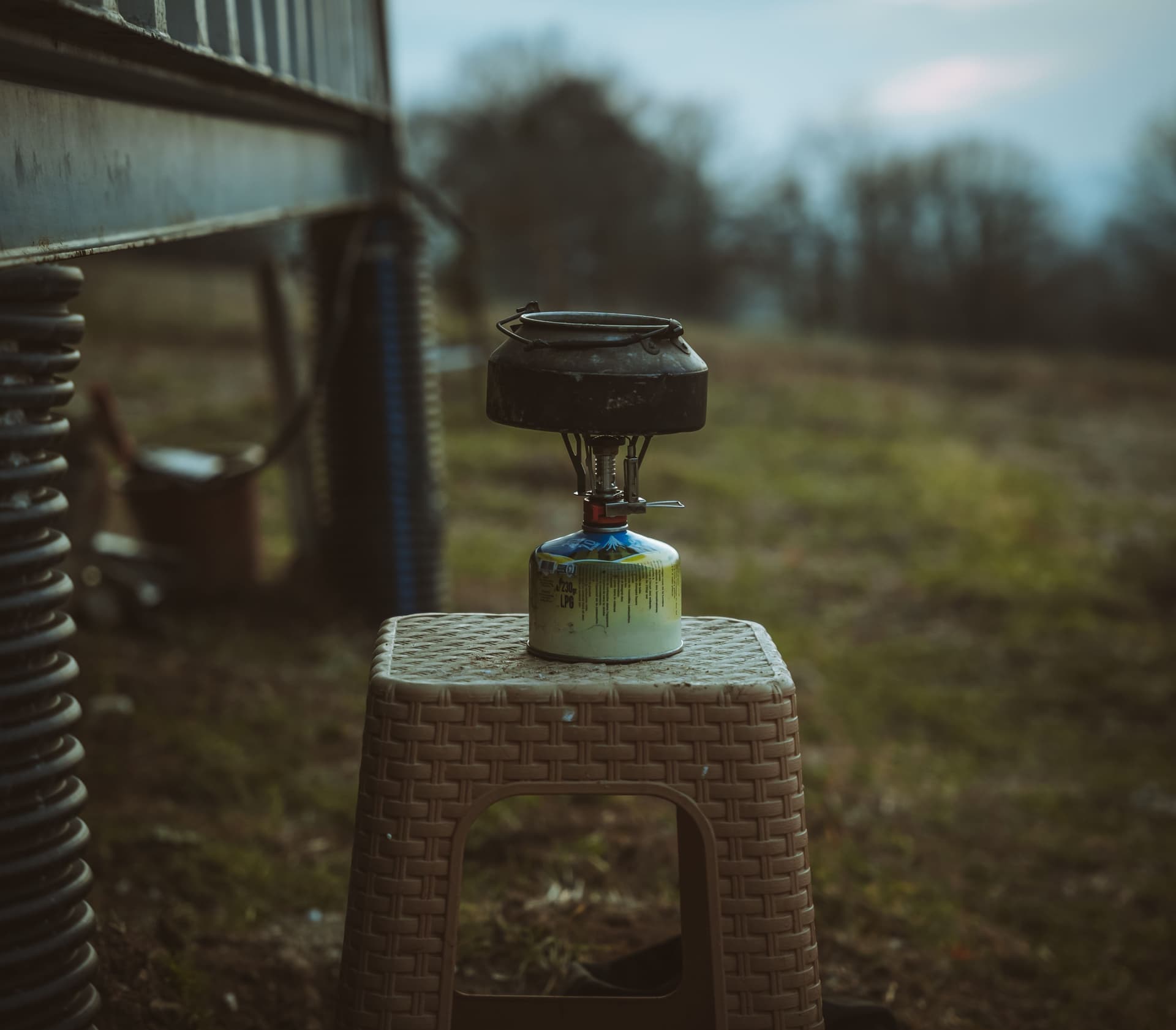 A gas flame burning outdoors in the evening