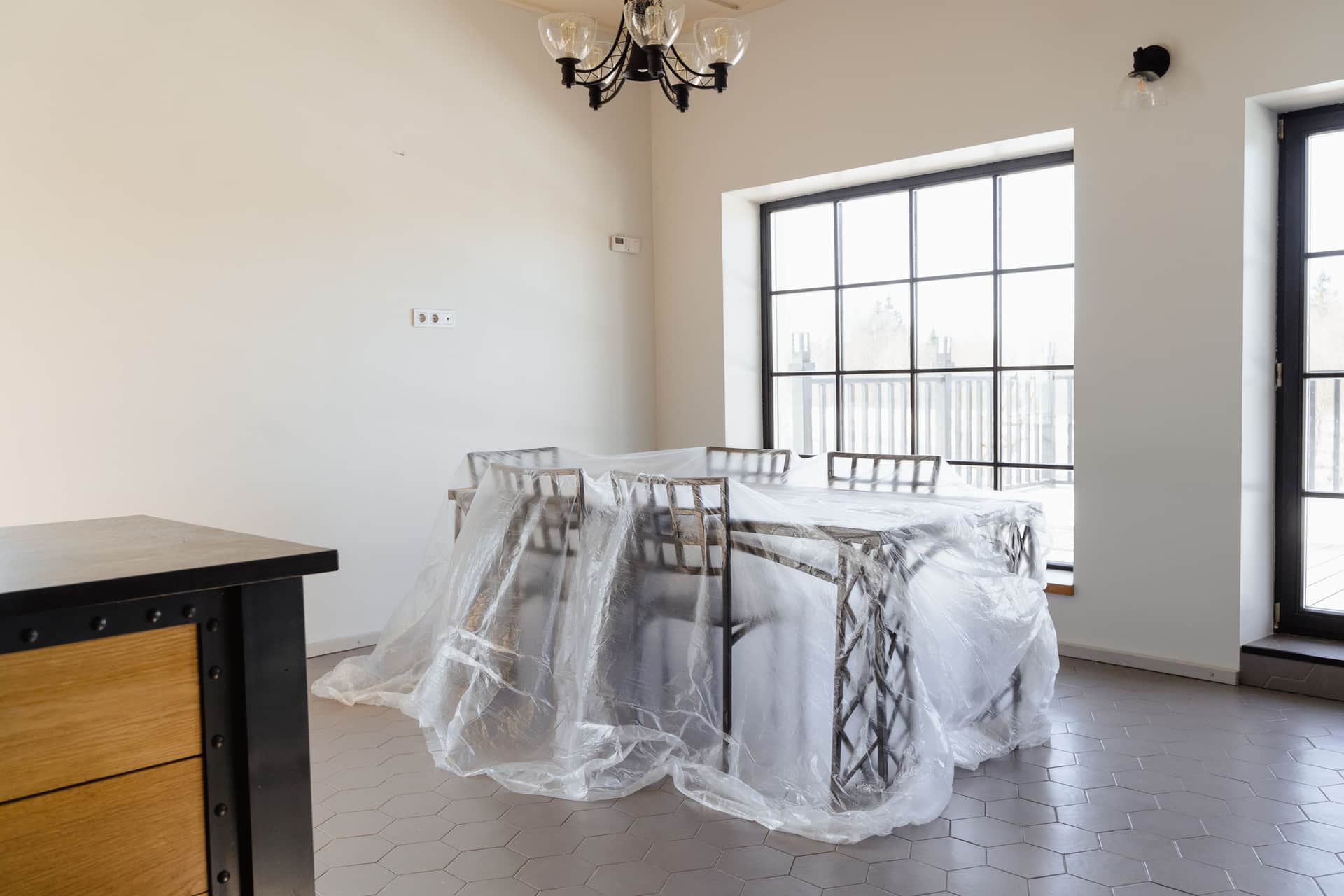Outdoor furniture under a protective cover
